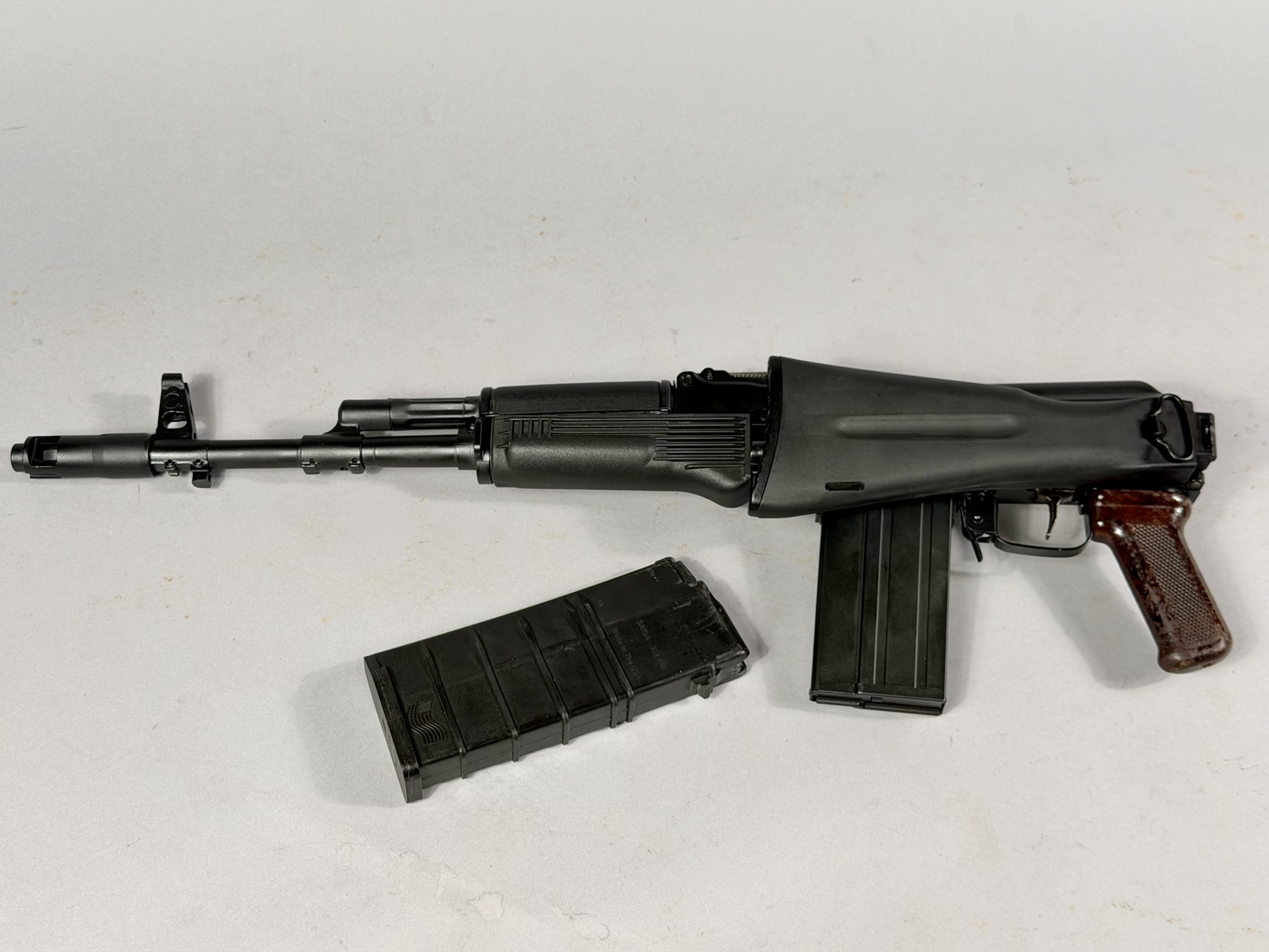 Top view, stock folded, with two U.S.-made magazines